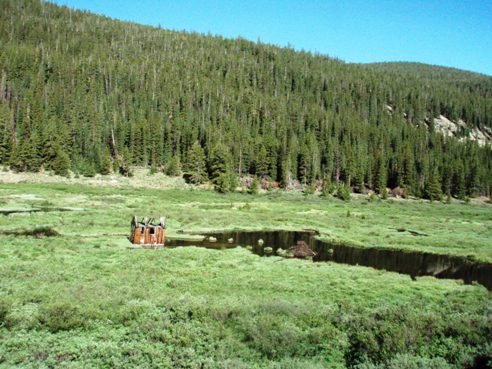 UTV trails at Cumberland pass Colorado, mine shack in pond